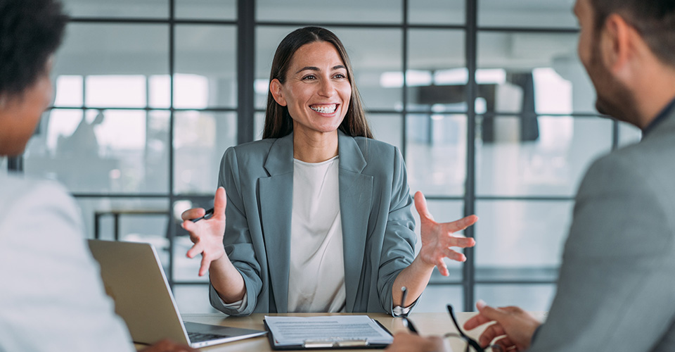 Female Business leader talking to her team